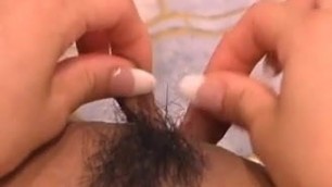 Asian Rubs her Huge Hairy Pussy