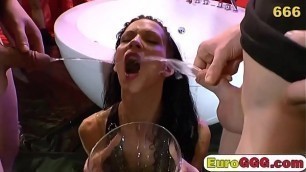 Skinny brunette hooker drinking cum and piss on gangbang sex act