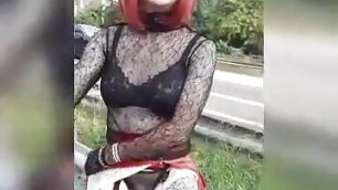 sissy in sexy outfit shows her clit by the ring road